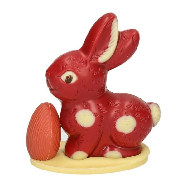 Sitting bunny small with egg, raspberry - chocolate Easter bunny - 8021060 1 scaled